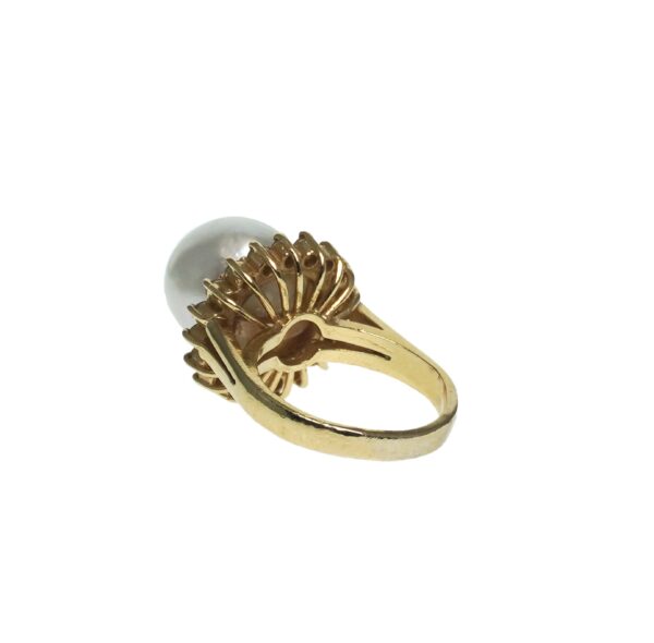 ladies yellow gold fourteen karat cultured pearl ring with twenty round brilliant cut diamond chips halo setting