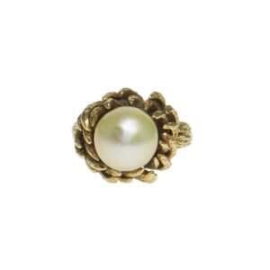 bold yellow gold fourteen karat bark style mounting with center cultured pearl