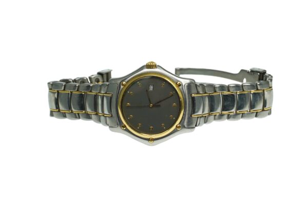 ebel nineteen hundred and eleven model number one eight seven nine zero two stainless steel quartz movement watch with date at three o clock eighteen karat yellow gold accents dark grey face gold toned hour markers and deployment clasp